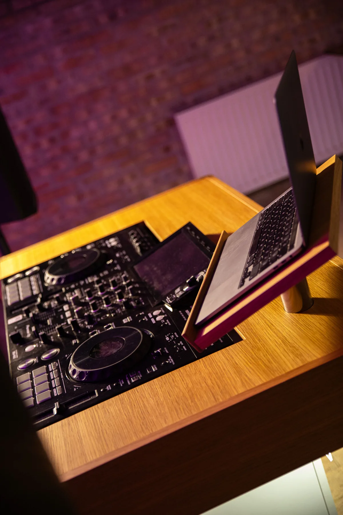Overhead detail of the laptop stand and work surface.